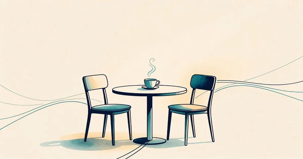 Dos sillas a una mesa, una taza, sin personas